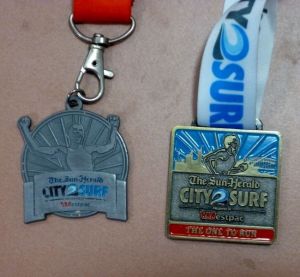 A little compare and contrast in finishing medals. Not sure if the 2014 version (Right) is better than 2013. Probably more visually appealing though.