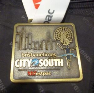 The City2South medal, a part of the Run Out Loud series that sponsors are looking to promote as opposed to individual events. Some believe the City2Surf medal should also look like this.